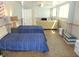 Open bedroom with two twin beds and access to the living room at 1001 Palmetto Blvd, Edisto Island, SC 29438