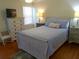 Comfortable bedroom with calming colors, a dresser, and a bedside table at 1001 Palmetto Blvd, Edisto Island, SC 29438
