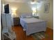 Cozy bedroom with a queen bed, beach decor, and a TV at 1001 Palmetto Blvd, Edisto Island, SC 29438