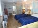 A bedroom with two twin beds, coastal decor, and an ensuite bathroom at 1001 Palmetto Blvd, Edisto Island, SC 29438