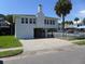 Coastal home featuring elevated construction, covered parking, and a fenced yard at 1001 Palmetto Blvd, Edisto Island, SC 29438