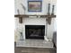 A charming fireplace with decorative mantle at 1001 Palmetto Blvd, Edisto Island, SC 29438