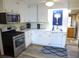 Modern kitchen with stainless steel appliances and bright cabinets at 1001 Palmetto Blvd, Edisto Island, SC 29438