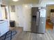 Galley kitchen featuring stainless steel refrigerator and modern appliances at 1001 Palmetto Blvd, Edisto Island, SC 29438