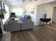 A stylish living room with hardwood floors that flows into the dining area at 1001 Palmetto Blvd, Edisto Island, SC 29438