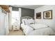 Stylish bedroom featuring neutral tones, a large bed with decorative pillows and bright natural lighting at 1031 Riverbed Retreat Ln, Summerville, SC 29485