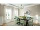 Elegant dining room with hardwood floors and bright, natural light from large windows at 1031 Riverbed Retreat Ln, Summerville, SC 29485