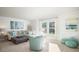 Bright living room with modern coastal decor, a comfortable sectional sofa, and ample natural light at 1031 Riverbed Retreat Ln, Summerville, SC 29485
