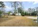 A large backyard features green lawn, shed, and fence in a residential neighborhood at 1043 Dominion Dr, Hanahan, SC 29410