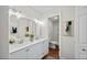 Bathroom featuring double sinks, white cabinetry, and a view into the shower at 1043 Dominion Dr, Hanahan, SC 29410