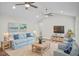 Bright and airy living room with vaulted ceilings, modern ceiling fans, and comfortable seating arrangement at 1043 Dominion Dr, Hanahan, SC 29410