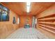 Shed interior with shelving, window, and linoleum tile flooring for storage at 1043 Dominion Dr, Hanahan, SC 29410