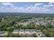 Overhead shot of an established neighborhood with tree lined streets and ample parking at 1064 Lexi Ct, Ladson, SC 29456