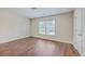 Bright bedroom with wood-look flooring and a window providing natural light and a pleasant view at 1064 Lexi Ct, Ladson, SC 29456