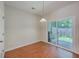 An open dining area that has wood-look floors and sliding doors leading to the outside at 1064 Lexi Ct, Ladson, SC 29456