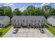 Exterior of townhomes featuring ample parking and neatly maintained landscaping at 1064 Lexi Ct, Ladson, SC 29456