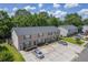 Exterior townhome shot showcasing parking spaces and neat landscaping at 1064 Lexi Ct, Ladson, SC 29456