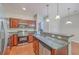 Well lit kitchen with stainless steel appliances and granite countertops adds style and functionality to this home at 1064 Lexi Ct, Ladson, SC 29456