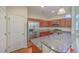 A kitchen with a countertop bar, stainless steel appliances, and stylish cabinets at 1064 Lexi Ct, Ladson, SC 29456