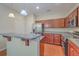 Modern kitchen with breakfast bar, stainless steel appliances, and hardwood floors at 1064 Lexi Ct, Ladson, SC 29456