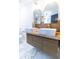 Bathroom featuring a double sink vanity, gold fixtures, and hexagonal tile flooring at 1129 Dickson Ave, Hanahan, SC 29410