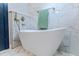 Modern bathroom featuring a standalone tub with gold fixtures and marble tiling at 1129 Dickson Ave, Hanahan, SC 29410