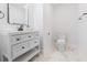 Well lit bathroom featuring white vanity, black hardware, modern mirror, tiled floors, and toilet at 1129 Dickson Ave, Hanahan, SC 29410