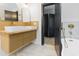 Bathroom featuring a double sink vanity, gold fixtures, and a modern design at 1129 Dickson Ave, Hanahan, SC 29410