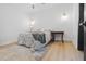 Bright bedroom features a ceiling fan, light hardwood floors, and neutral decor at 1129 Dickson Ave, Hanahan, SC 29410