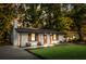 Charming brick home featuring a manicured lawn, wooden shutters, updated paint, and a new roof for great curb appeal at 1129 Dickson Ave, Hanahan, SC 29410