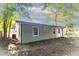 Back side of the home featuring a combination of vinyl and brick siding at 1129 Dickson Ave, Hanahan, SC 29410