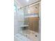 Shower features a glass door, built-in seat, and a unique pebble floor at 1129 Dickson Ave, Hanahan, SC 29410