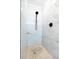 Contemporary shower featuring marble tiling, a black shower head, and a pebble floor at 1129 Dickson Ave, Hanahan, SC 29410