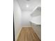 Spacious walk-in closet with custom shelving and wood-look floors at 1129 Dickson Ave, Hanahan, SC 29410