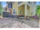 View of the back of the house with a patio and backyard covered in light dirt and wood fencing at 1184 Dingle Rd, Mount Pleasant, SC 29466