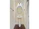 Stylish half bathroom featuring a pedestal sink, decorative mirror, and modern lighting at 1184 Dingle Rd, Mount Pleasant, SC 29466