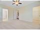 Spacious bedroom showcasing neutral tones, ceiling fan, and access to other rooms at 1184 Dingle Rd, Mount Pleasant, SC 29466