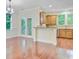 Bright dining area with hardwood flooring, chandelier, and access to the kitchen at 1184 Dingle Rd, Mount Pleasant, SC 29466