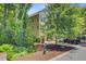 Charming yellow two-story home surrounded by lush greenery and well-manicured landscaping at 1184 Dingle Rd, Mount Pleasant, SC 29466