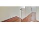 Hallway with hardwood flooring, white baseboards and trim, and access to stairs at 1184 Dingle Rd, Mount Pleasant, SC 29466