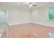 Open living area with hardwood flooring, a ceiling fan, and bright natural light from the window at 1184 Dingle Rd, Mount Pleasant, SC 29466