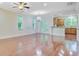 Spacious living room featuring hardwood floors, a ceiling fan, and access to the kitchen at 1184 Dingle Rd, Mount Pleasant, SC 29466