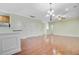 Open living room featuring hardwood floors, a chandelier, and access to the kitchen at 1184 Dingle Rd, Mount Pleasant, SC 29466