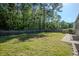 A spacious backyard featuring a well-maintained lawn and surrounded by a wooden fence at 123 Lagoona Dr, Summerville, SC 29483