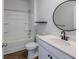 Bright bathroom featuring a vanity with a modern faucet, a stylish mirror, and a shower-tub combo at 123 Lagoona Dr, Summerville, SC 29483