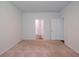 Carpeted bedroom featuring a double-door closet and open door leading to the en-suite bathroom at 123 Lagoona Dr, Summerville, SC 29483