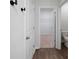 Hallway features wood floors, open door to closet, and partial view into the bathroom at 123 Lagoona Dr, Summerville, SC 29483