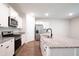 Open-concept kitchen featuring granite countertops, stainless steel appliances, and ample cabinet space at 123 Lagoona Dr, Summerville, SC 29483