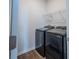 A laundry room featuring a modern black washer and dryer set and overhead shelving at 123 Lagoona Dr, Summerville, SC 29483
