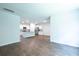Open-concept living area showcasing wood floors, recessed lighting, and a view to the modern kitchen at 123 Lagoona Dr, Summerville, SC 29483